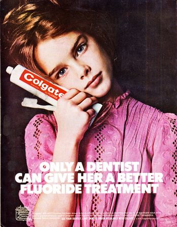Ad featuring 10-year-old Brooke Shields holding a tube of Colgate fluoride toothpaste - copy reads Only a dentist can give her a better fluoride treatment