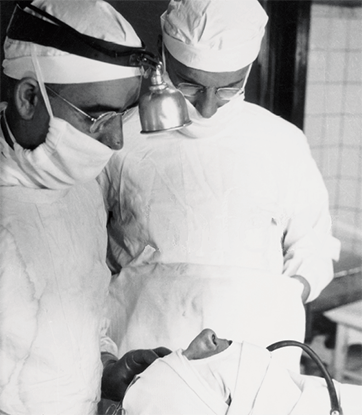 Dr. Claire Straith and a colleague performing surgery