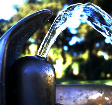 Fluoridated drinking water fountain running