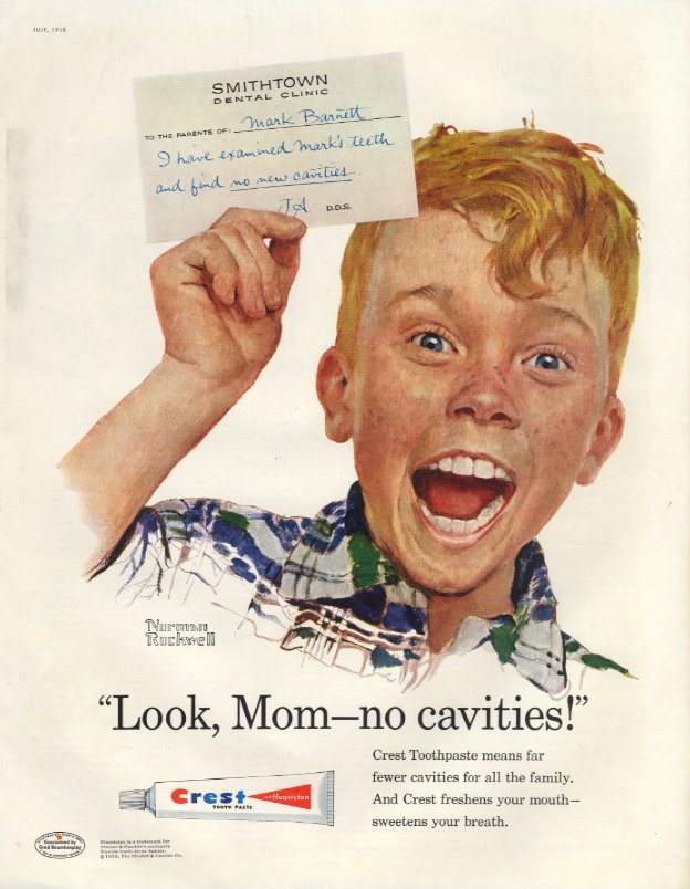 Norman Rockwell portrait of child Mark Barnett has a big excited smile and holds up a note from Smithtown Dental Clinic with a note from the dentist saying 'I have examined Mark's teeth and find no new cavities.' Bottom of ad for Crest toothpaste features the slogan 'Look Mom no cavities,' an image of a tube of Crest toothpaste, and more ad copy.