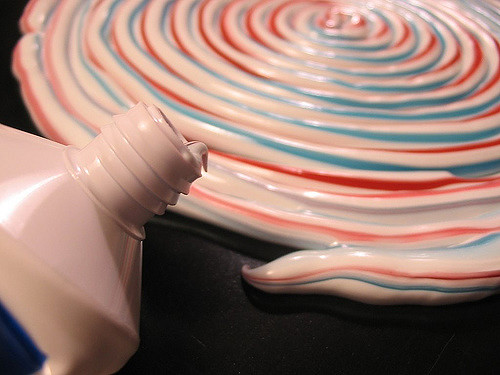 A large spiral of striped toothpaste