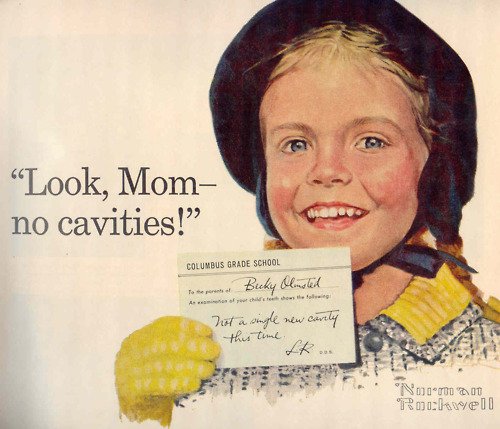 One of Norman Rockwell's historic ads for the first fluoride toothpaste, Crest, showing smiling girl and slogan 'Look Mom - no cavities'